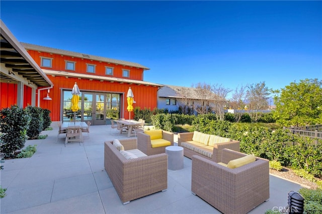 view of patio / terrace with an outdoor living space and french doors