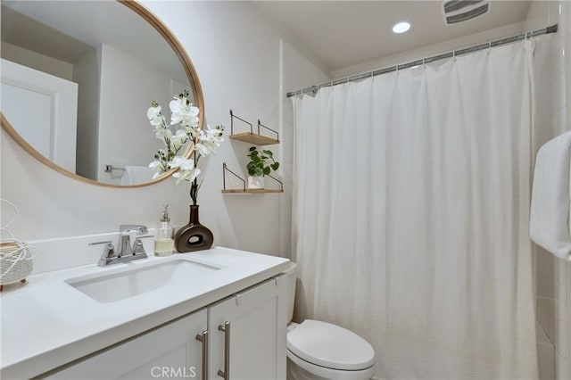 bathroom with vanity, toilet, and a shower with shower curtain