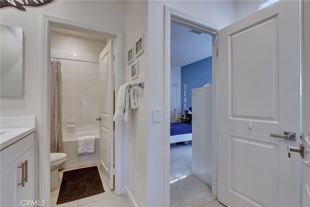 full bathroom featuring shower / tub combo, vanity, and toilet