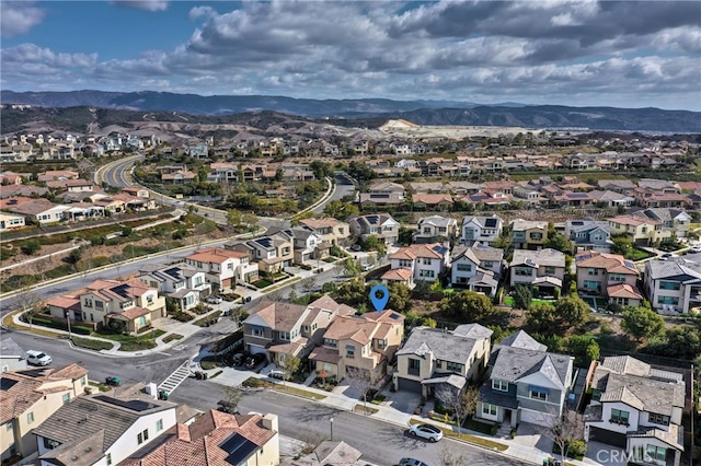 birds eye view of property featuring a mountain view