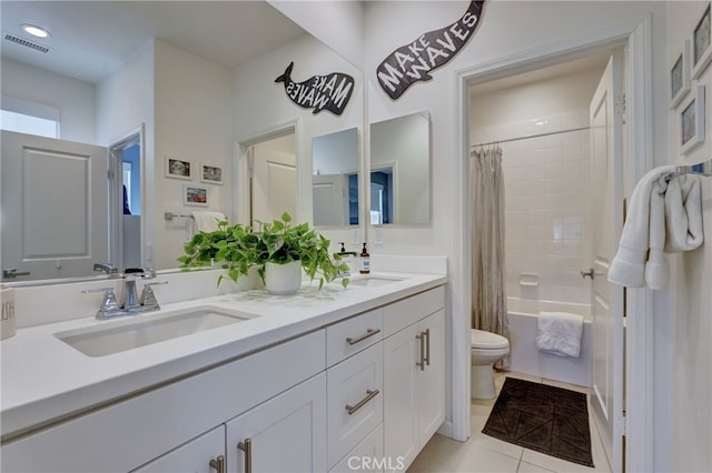 full bathroom featuring tile patterned flooring, shower / tub combo, vanity, and toilet