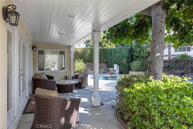 view of patio featuring a fenced in pool