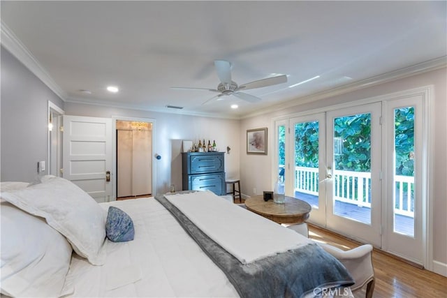 bedroom with french doors, crown molding, access to outside, ceiling fan, and hardwood / wood-style floors