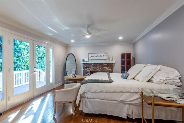 bedroom featuring crown molding, ceiling fan, access to exterior, and hardwood / wood-style floors