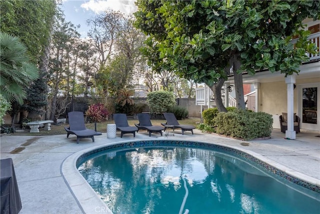 view of swimming pool with a patio area