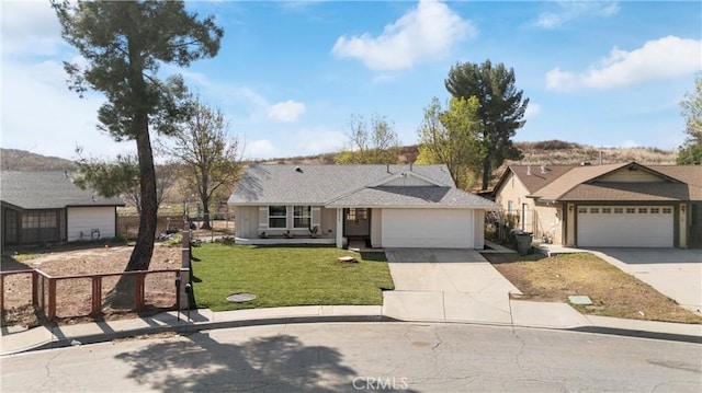 single story home featuring a garage and a front yard