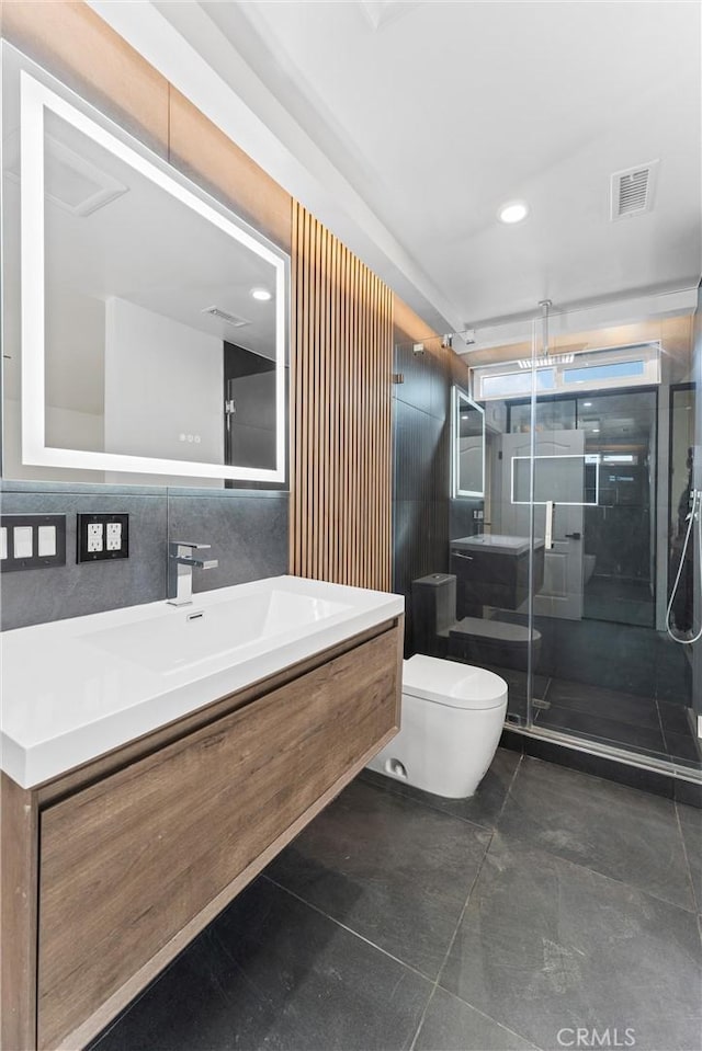 bathroom with vanity, an enclosed shower, and toilet