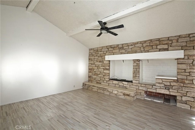 unfurnished living room with beam ceiling, high vaulted ceiling, ceiling fan, and hardwood / wood-style flooring