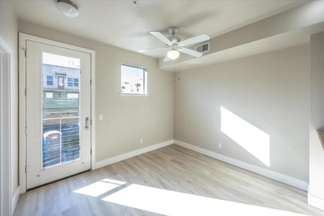 interior space with ceiling fan and light hardwood / wood-style floors