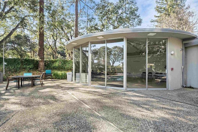 exterior space featuring a sunroom