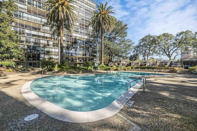 view of swimming pool featuring a patio area