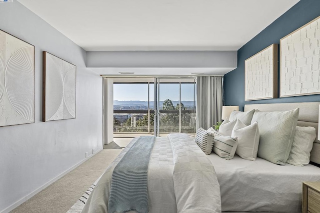 carpeted bedroom featuring a mountain view