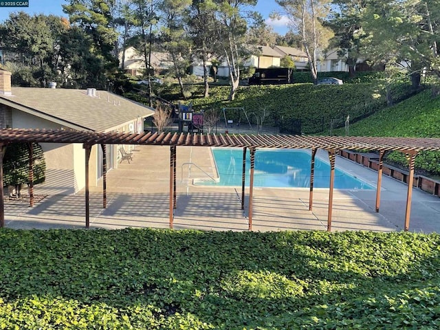 view of swimming pool featuring a patio area