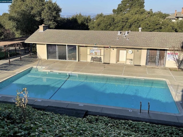 view of swimming pool with a patio area