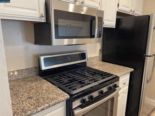 kitchen featuring white cabinetry and stainless steel appliances