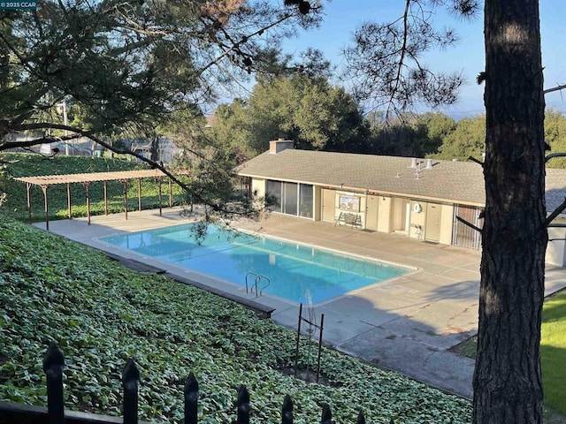 view of pool featuring a patio area and a pergola