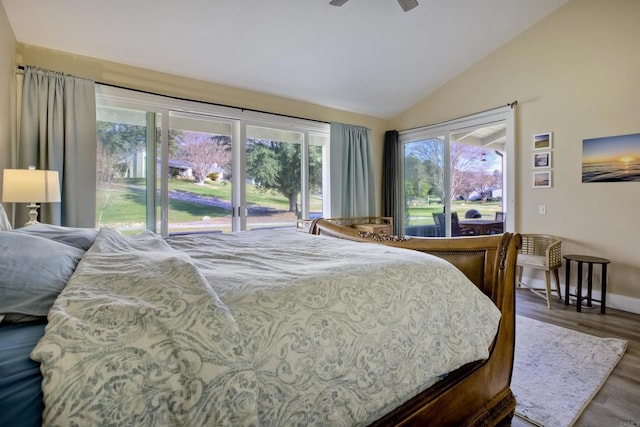 bedroom with vaulted ceiling, hardwood / wood-style floors, and ceiling fan