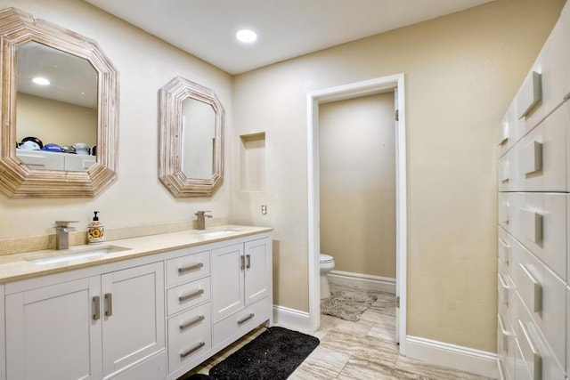 bathroom with vanity and toilet