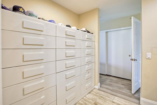 spacious closet featuring light hardwood / wood-style floors