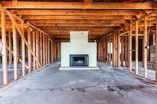 miscellaneous room featuring a brick fireplace