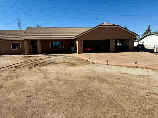 ranch-style house featuring a garage