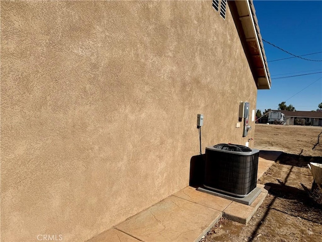 view of property exterior with cooling unit