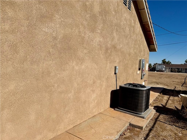 view of property exterior featuring central air condition unit