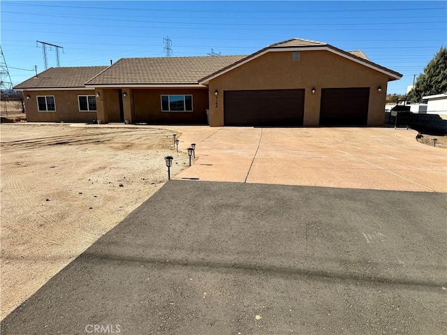 single story home featuring a garage