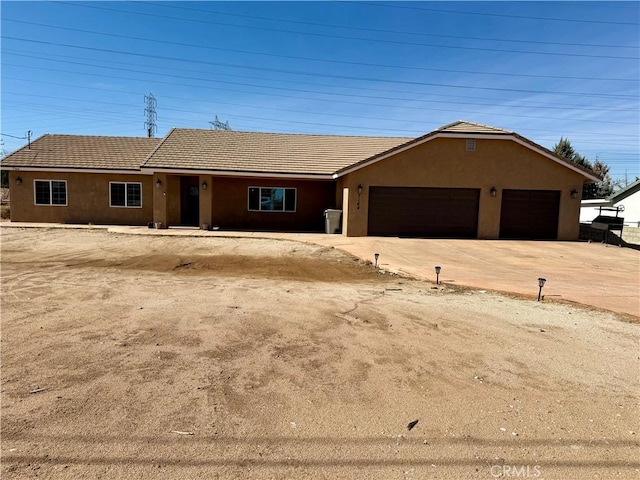 ranch-style home with a garage