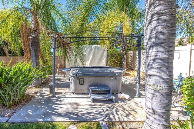 view of patio / terrace featuring a hot tub