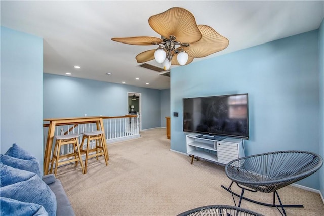 living room with ceiling fan and light colored carpet