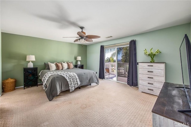 bedroom featuring access to exterior, light colored carpet, and ceiling fan