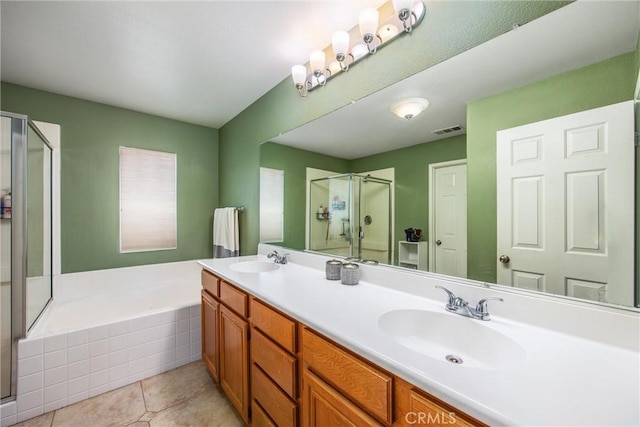 bathroom with plus walk in shower, tile patterned floors, and vanity