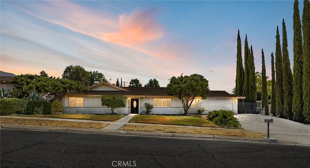 ranch-style house featuring a garage