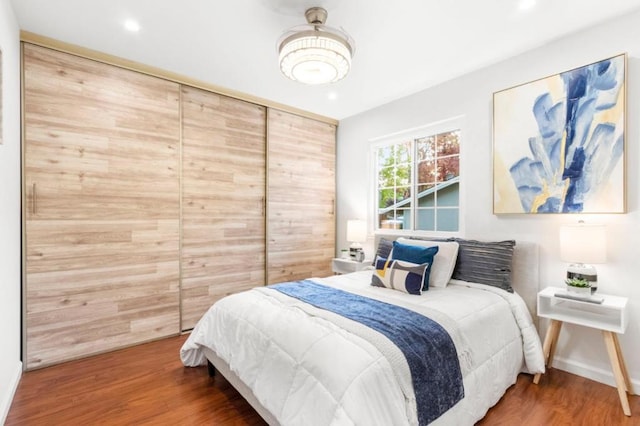 bedroom with hardwood / wood-style floors