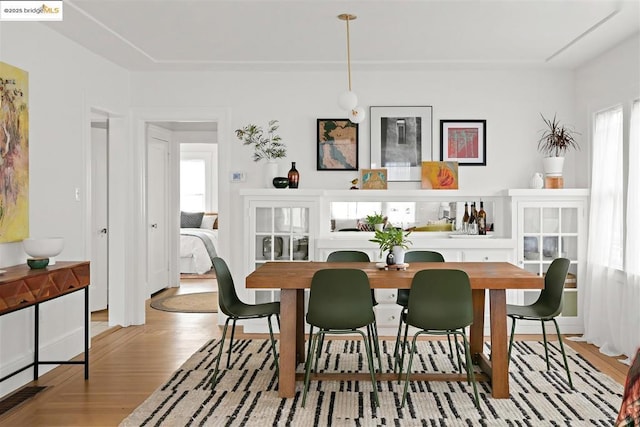 dining area with light hardwood / wood-style floors