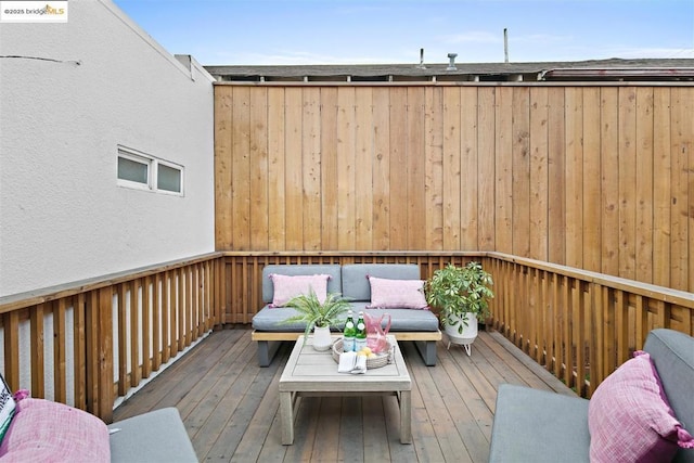 wooden deck featuring an outdoor living space