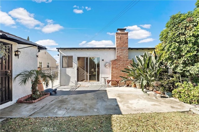 rear view of property with a patio