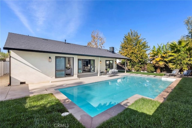 view of pool featuring a patio area and a lawn