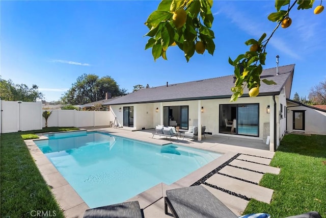 view of pool with a yard and a patio area