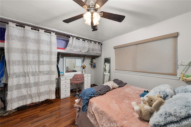 bedroom featuring ceiling fan and dark hardwood / wood-style flooring