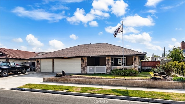 ranch-style home featuring a garage