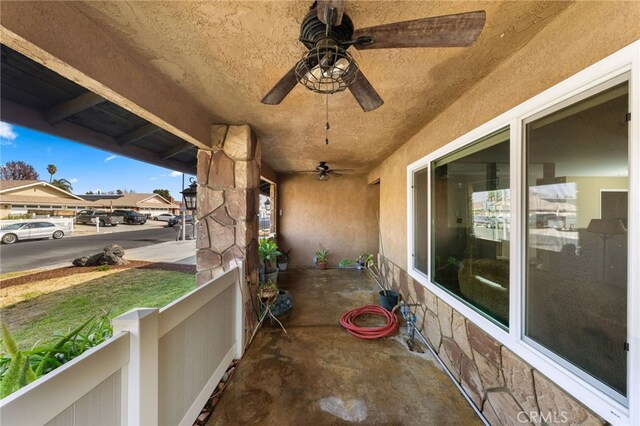 view of patio / terrace featuring ceiling fan