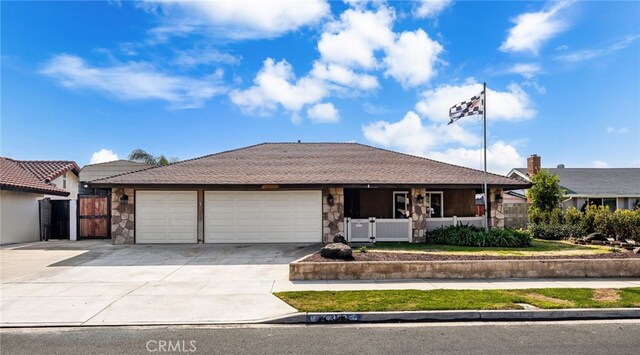 ranch-style home featuring a garage