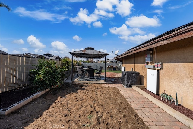 view of yard with a gazebo and a patio