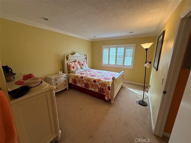 carpeted bedroom with crown molding and a textured ceiling