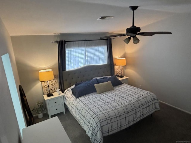 bedroom featuring dark carpet and ceiling fan