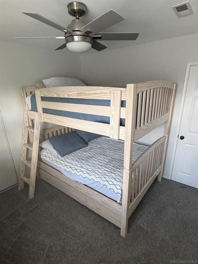 carpeted bedroom with ceiling fan