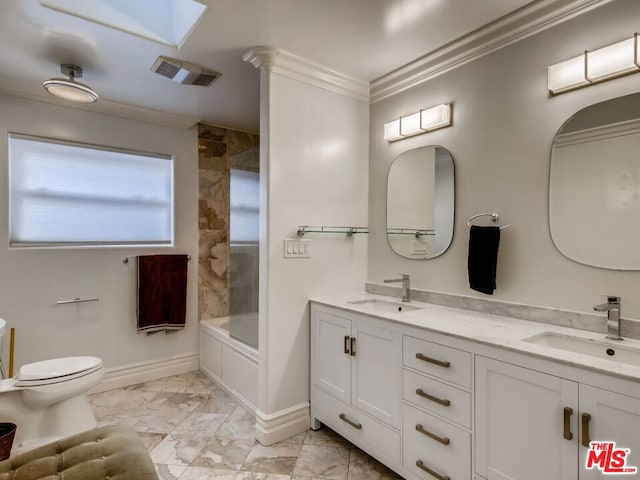 full bathroom featuring ornamental molding, toilet, tiled shower / bath combo, and vanity