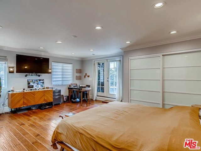 bedroom featuring ornamental molding, wood-type flooring, and access to outside